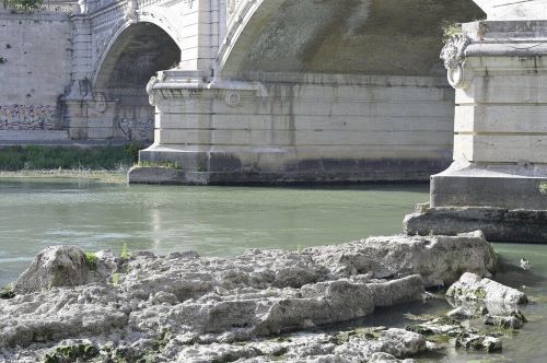 Ruins of the Neronian bridge appear from the dry bed of the Tiber