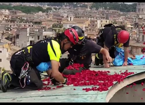 Firefighters spreading flowers at the Pantheon on Pentecost 